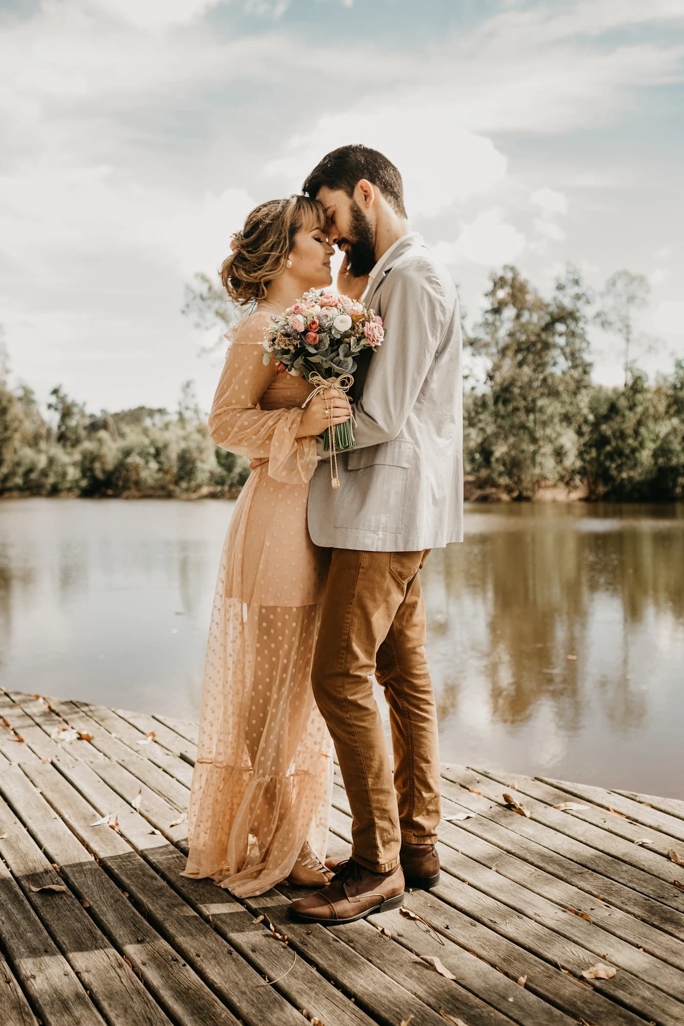 Couple embracing beside the water